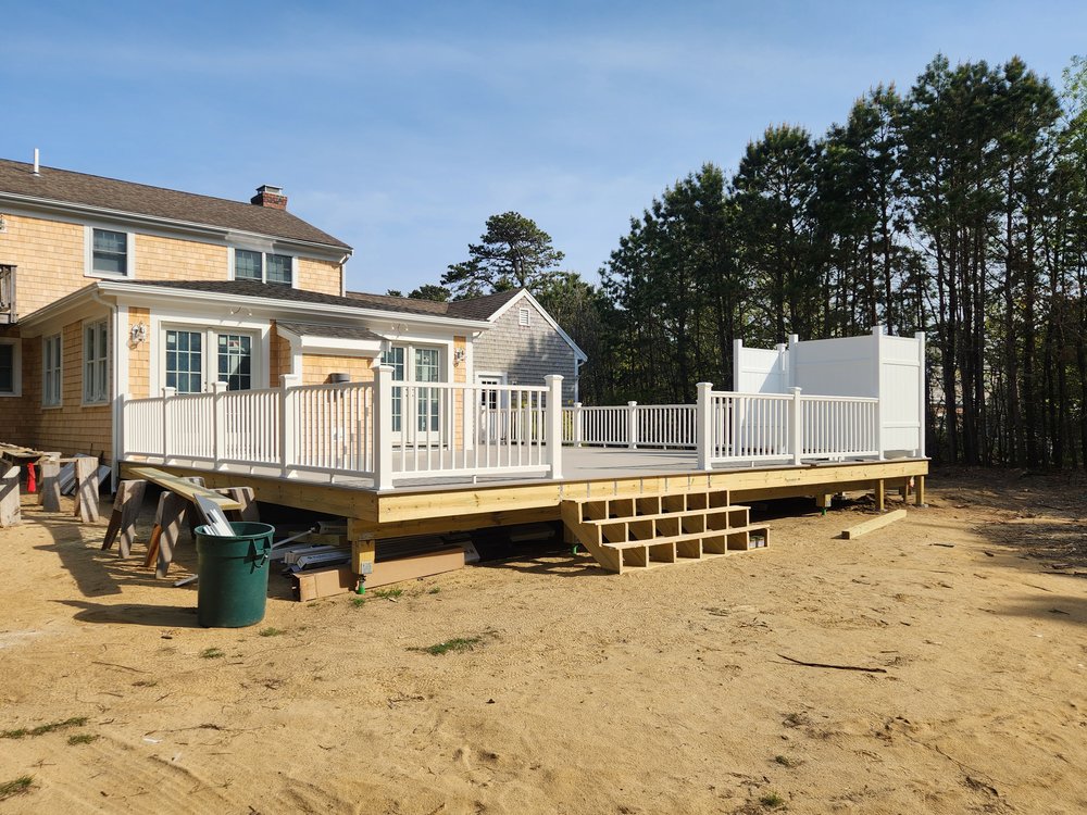 Finished railing and outdoor shower installation