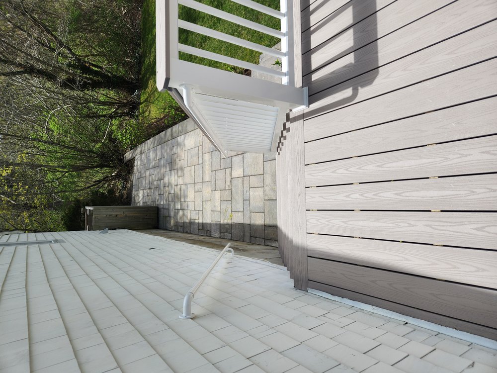 A nice new Beacon Hill Flagstone Paver Patio connecting the outdoor shower with the new deck